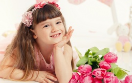 Beautiful Little Girl With Flowers And Toys