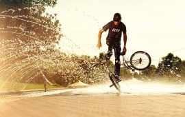 Bikes Man And Water Spray