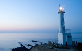 Blue Lighthouse at Sunset