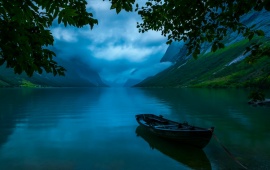 Boat On Calm Mountain Lake