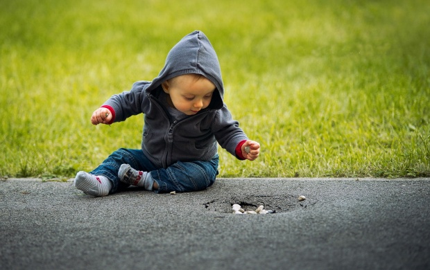 Boy Sitting On Street (click to view)