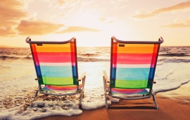 Chairs On Summer Sunset Beach