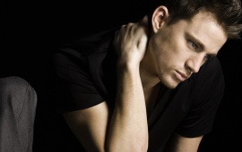 Channing Tatum Sitting In Black T-Shirt