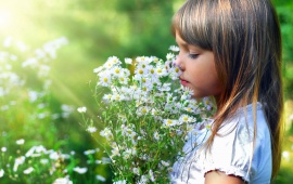 Child In Flower Field