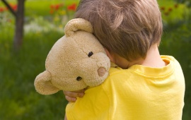 Child With Comfort Bear
