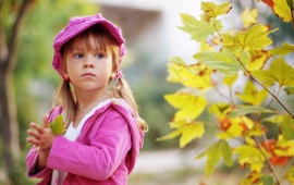 Cute Child Walking In Autumn Park