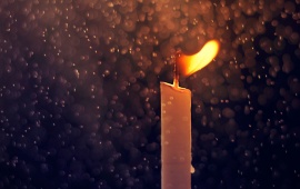 Fire Candle And Rain Drops