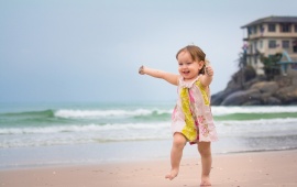 Happy Girl Running In Beach