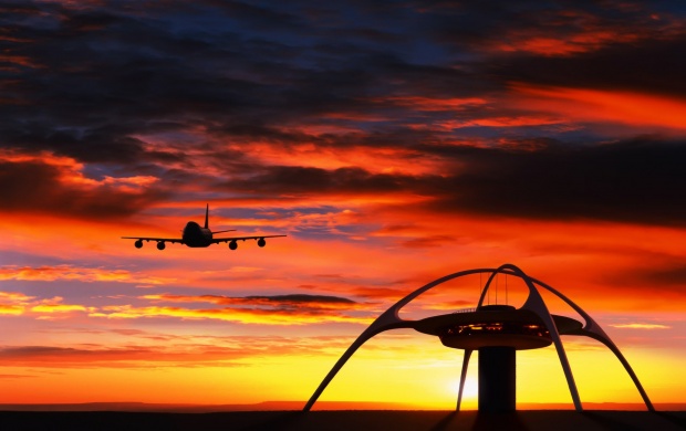 Landing Plane At Sunset