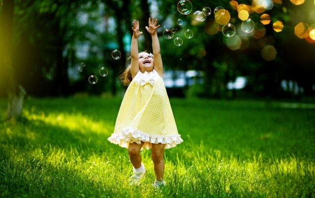 Little Girl Playing With Bubbles