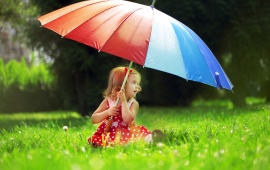 Little Girl With A Rainbow Umbrella