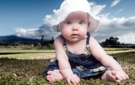 Little Girl With White Cap