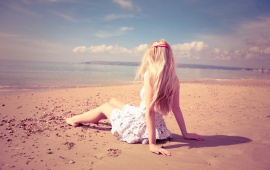 Lonely Blonde Girl on the Beach