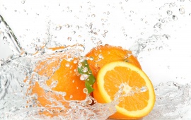 Orange Fruits And Splashing Water
