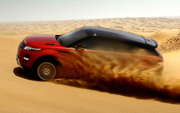 Red Land Rover In Desert