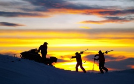 Skiers At Sunset