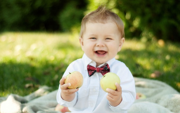 Smiley Baby Holding Apple