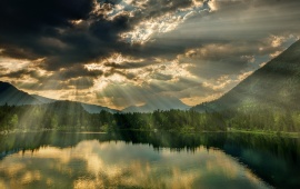 Sun Rays Over A Lake