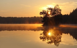 Sunset Over a Misty Lake