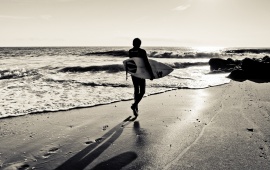 Surfer On The Ocean Beach