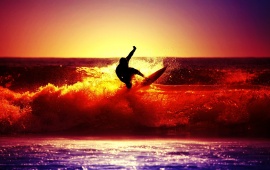 Surfing In Sunset Light