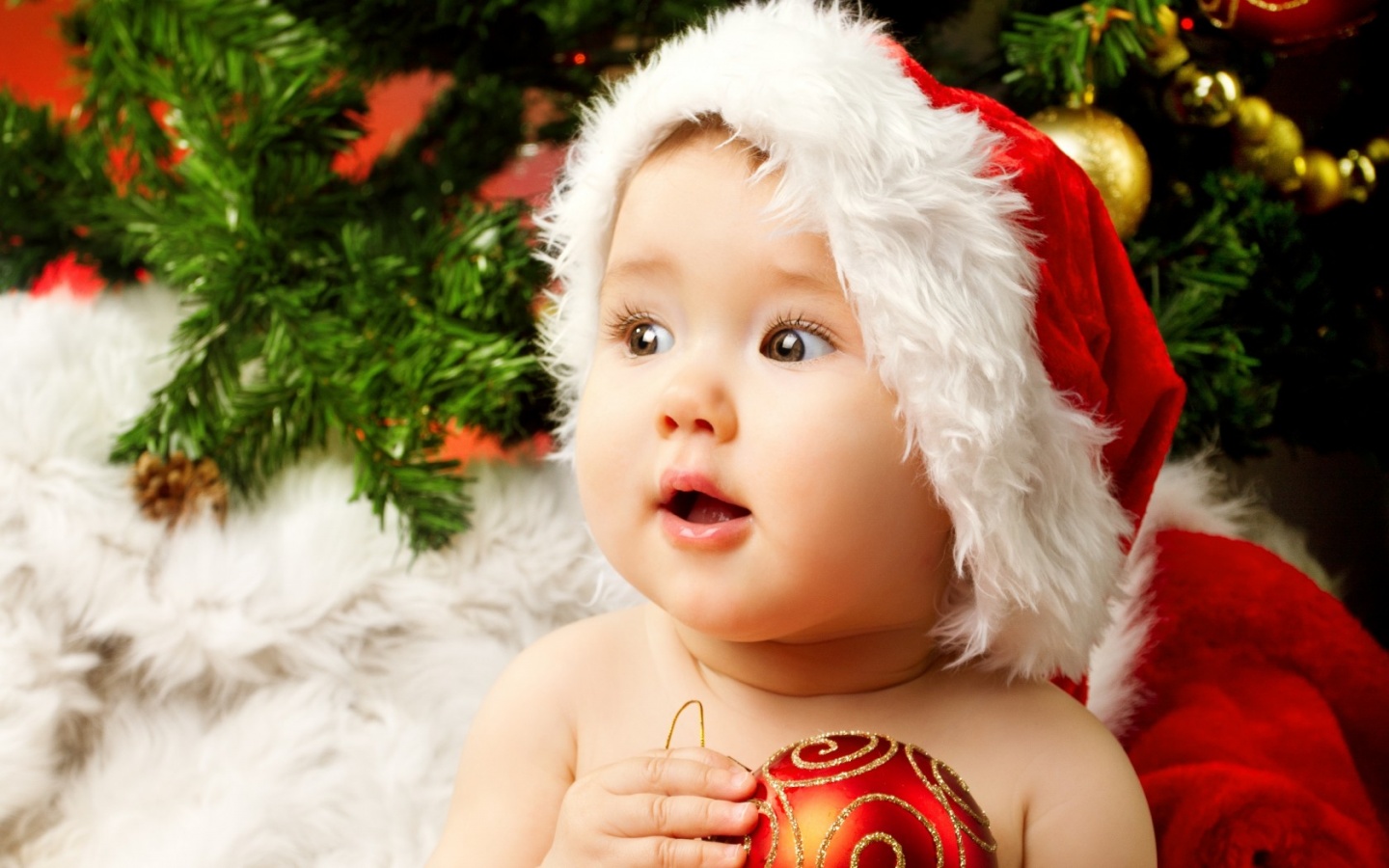 Christmas Baby Holding Red Ball