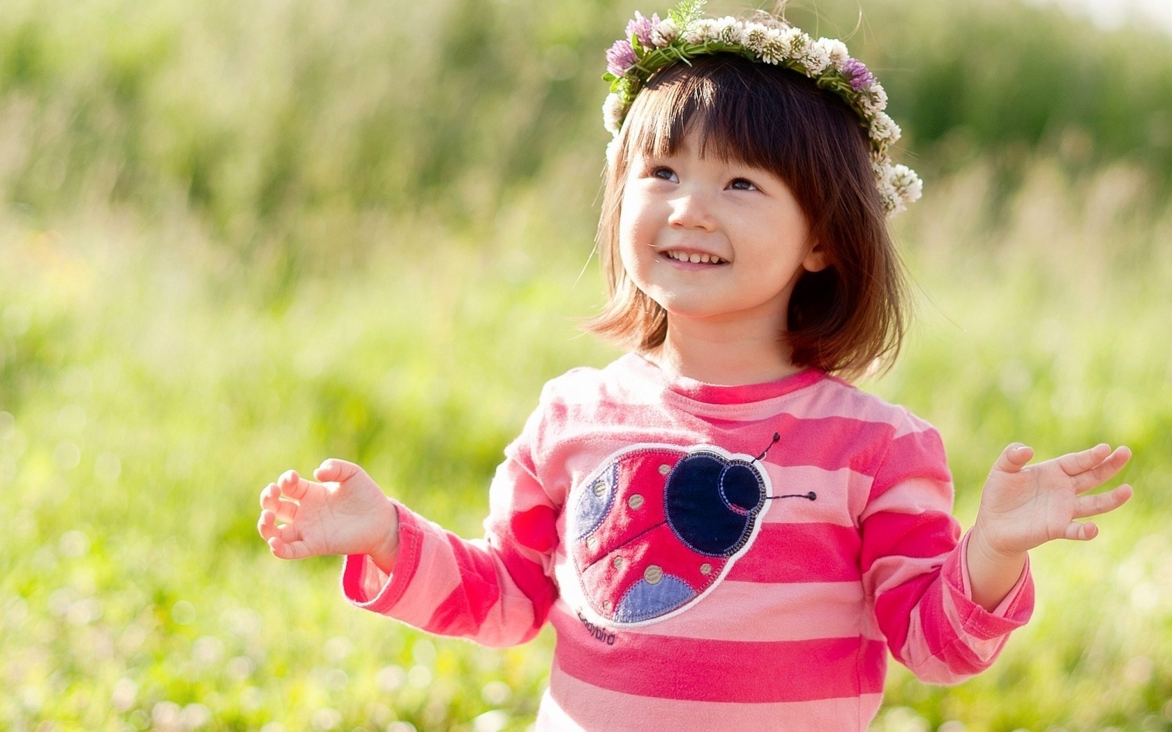 Happy Little Girl In Flowers Wreath
