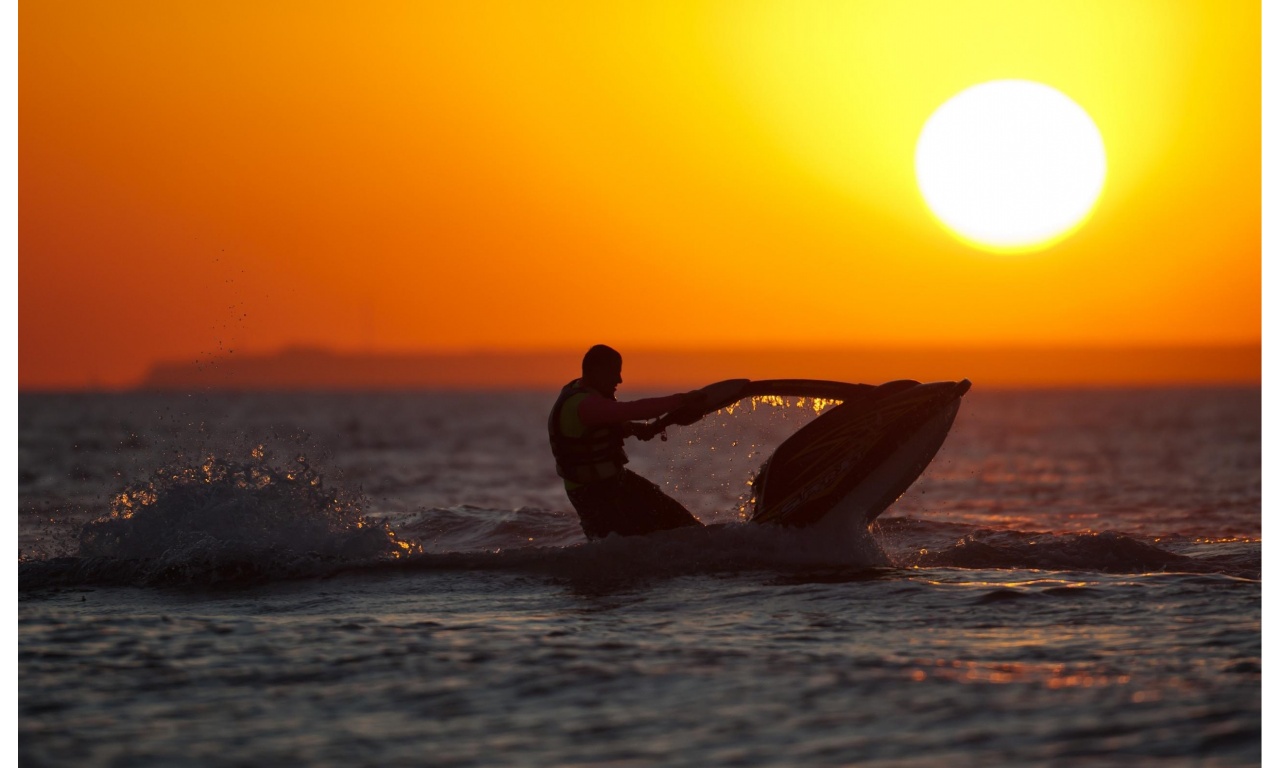 Jet Skis In The Sea At Sunset