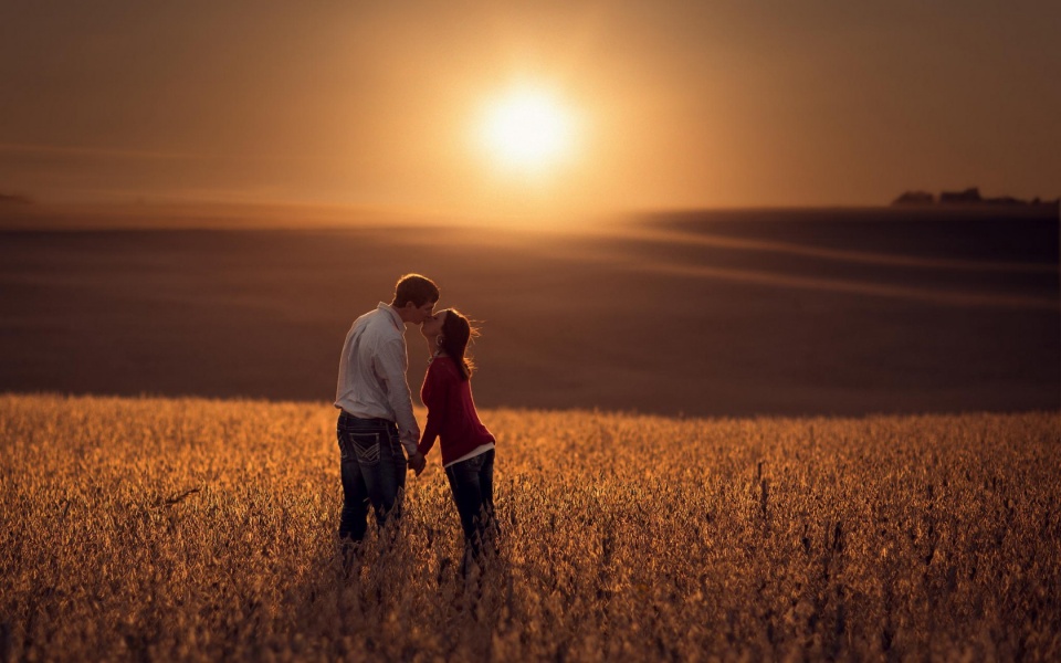 Lovers Kiss At Sunset Field