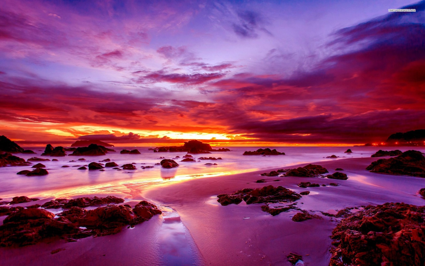 Purple Sunset on Rocky Beach