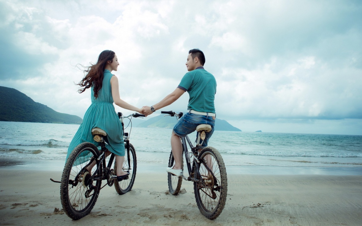 Riding Bicycles On Beach